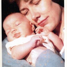 Julia as a newborn held by her loving Mother