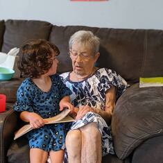 Hannah reading with grandma 2021