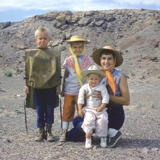 Mom and kids in Moab looking for rocks.