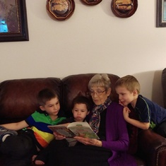 Grandma reading to Simon, William, and Benjamin