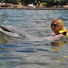 Julia swimming with dolphin