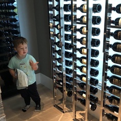 Helping Buelo pick out a bottle of wine for dinner