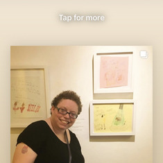 Julie with her artwork at the Woodmere art museum
