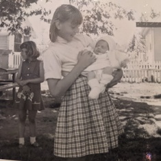 June - Age 10 - 1962 - holding baby sister Lois.