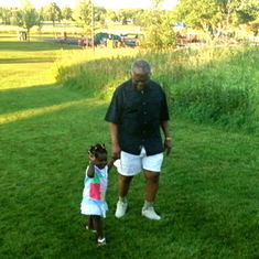 Grandpa loved to walk! Here he is walking up a hill with grand-daughter Feyikemi in Wisconsin, U.S.A