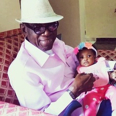 With granddaughter, Ola Ogbonna Kalu