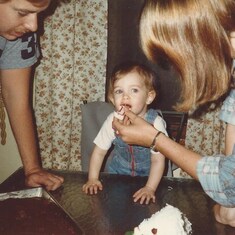 Nikki having her first B-Day lamb cake with Jeff & Karen.