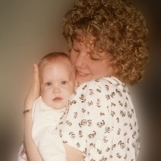 Karen cuddling new granddaughter Lexi - 1990