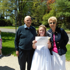 Alyssa with her poppy and nanny at her First Communion! :)