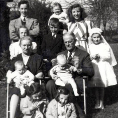 Manma and Peepa at Kath's First Holy Communion in 1939 with Kath's 6 siblings and 3 extra children