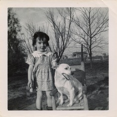 A very young Kathleen with her dog, Lady