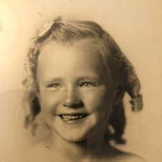 Kathryn as a young girl. The original shows pencil lines where she attempted to improve her curls.