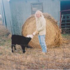Kay and one of her baby cows that she bottle fed