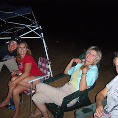 Kay with Brad, LaShell and Kena, watching fireworks on the beach at Lake Texhoma 2009. Our last summer together.  So much fun!