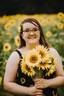 Kayley surrounded by her favorite flower.