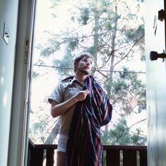 One of the photos Keith kept of himself. nd. He wrote on the back, "Alas poor beach towel, I know it well. (Beach towel from childhood)." This was taken on his porch in Palo Alto. nd