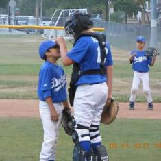 Who would thought the big kid and little one helping each other on the field