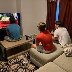 Keith Alex Kale playing video games at football camp in Utah during Covid