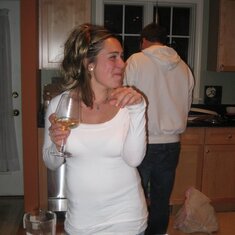 Pretty Kelly in her element... cooking, laughing,  and drinking a little vino with family and friends!