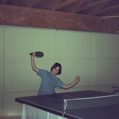 Kelly and brother Hal playing table tennis 
