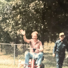 BARRY loved mowing a yard. This is Barry with Donald's dad on mower at farm in Doniphan, MO
