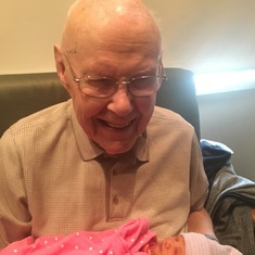 Meeting his first great granddaughter, Charlotte Parsley
