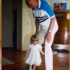 G‘pa with Livia (3yrs) twirling through his legs