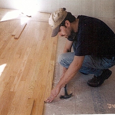 House Ken installing hardwood floor