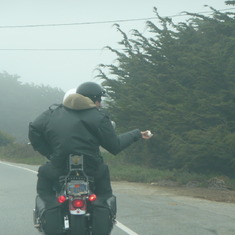 James sprinkling some of Dad's ashes off the back of his old bike. Just south of Pescadero road on Hwy1.