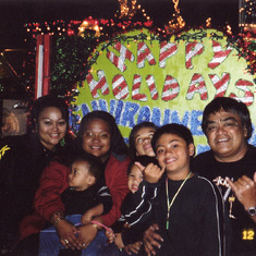 HIs 3 daughters and 3 grandsons on a float dad made for Honolulu City & County City Lights Parade.