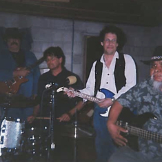 Ken Joseph playing guitar with Thomas