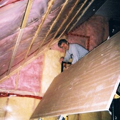 Here he is on scaffolding, with his bud Sean, gun in hand nailing boards to 20' high ceiling.