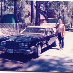 Granddad sporting his sweet Cadillac.