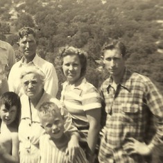 Kenny with his Mom and Dad and his sister Cleo with her kids, JW, Wayne, and Gaylen about 1944...