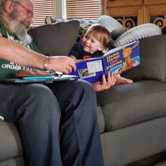 Grandpa reading Archers favorite book