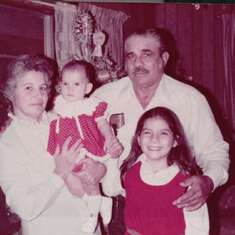 Kennie 12/25/1981 with her Pama, Pamo and Tia Jessica at her Pamo's house,her first Christmas. Merry Christmas in Heaven Kennie, we love you, we love Pamo just the same.