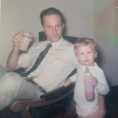 1970 Cheers - Dad and son toast some Florida OJ.