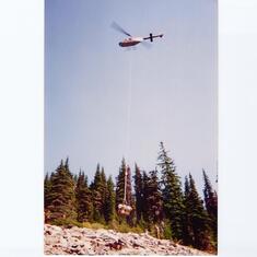 Nothing like the sound of a heli overhead, delivering needed supplies.  MT Aug. 1994