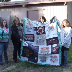This beautiful quilt was made by Stacey H. and Melissa Z. from some of Kenton's fire shirts. And the matching pillows, Melissa, also made.  Pictured left to right.   Stacey H., Melissa Z.,  Heidi W. and Nina H.   May 19th, 2016