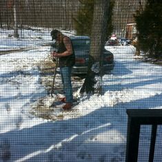 Shoveling snow in a tanktop,