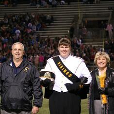 Kirk with his parents for Shawnee Mission West's Senior night, Homecoming game, 2013