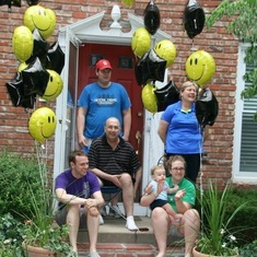 The family listening to the Shawnee Mission West Marching Band play for Dad in his front yard, July 25, 2013