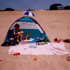 hilary and cody buired in the sand