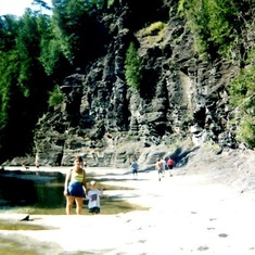 mom and avery pose at the creek