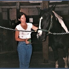 Grooming her horse Max at a stable in Milton, Ontario, Canada  in August of 1999