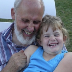 Opa and his granddaughter sharing a joke
