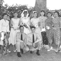 1959 Pete & Kotha Wedding photo in the garden of the Eastern & Oriental Hotel. Left to right: Leila, Ruby, Habibah, unknown, June, Kotha, Guat, Alma, unknown, unknown, unknown, Mei Lin. Front: Peter & Graham.