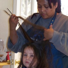 Auntie Kris giving Lauren a haircut