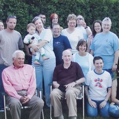 Holding her first grandkid at a gathering of friends and family ~2003