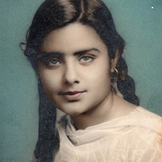 Kusum as a teenager in pigtails.